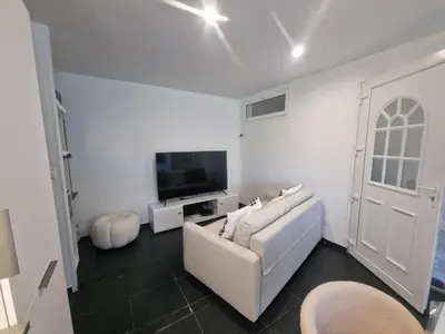 Télévision ou salle de divertissement dans l'établissement Appartement a 2 pas de la plage