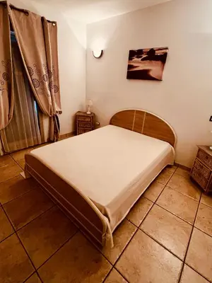 Un ou plusieurs lits dans un hébergement de l'établissement Casa di Lumio, piscine privée