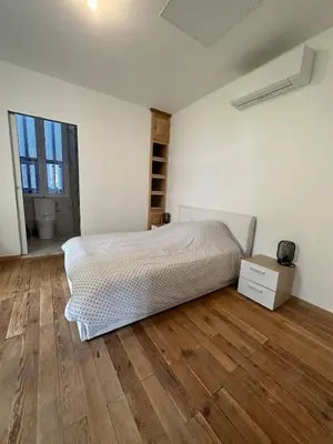 Un ou plusieurs lits dans un hébergement de l'établissement Superbe appartement en centre ville