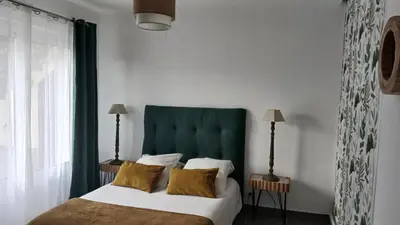 Un ou plusieurs lits dans un hébergement de l'établissement Maison de village 3 chambres vue mer