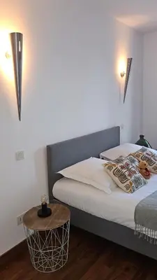 Un ou plusieurs lits dans un hébergement de l'établissement Maison de Maître Albitru - Domaine Romella - Piscine - Vue Golfe St-Florent