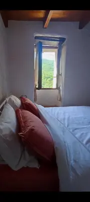 Un ou plusieurs lits dans un hébergement de l'établissement Maison typique de village Corse , 15min Aéroport et de la mer CASA SCALINA