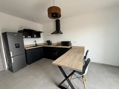 Cuisine ou kitchenette dans l'établissement E casette