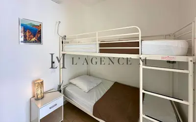 Un ou plusieurs lits dans un hébergement de l'établissement Studio Bis Rivages 100m de la plage, lumineux