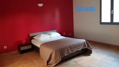Un ou plusieurs lits dans un hébergement de l'établissement Gite de 90m2 proche de la mer avec grande piscine MONTI