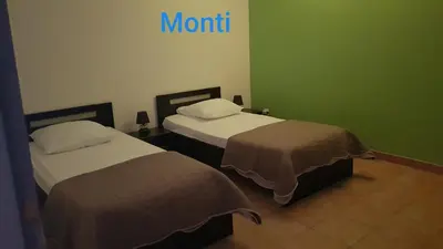 Un ou plusieurs lits dans un hébergement de l'établissement Gite de 90m2 proche de la mer avec grande piscine MONTI