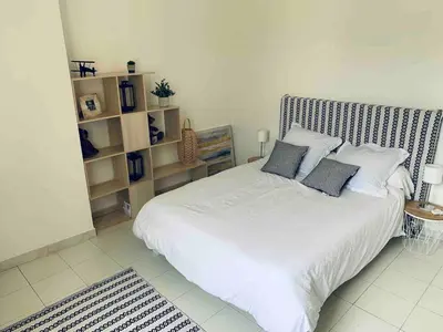 Un ou plusieurs lits dans un hébergement de l'établissement Appartement en centre ville