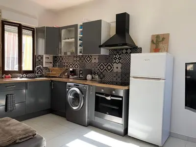 Cuisine ou kitchenette dans l'établissement Appartement en centre ville
