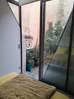 Un ou plusieurs lits dans un hébergement de l'établissement Chambres de charme au cœur de la citadelle de Bastia