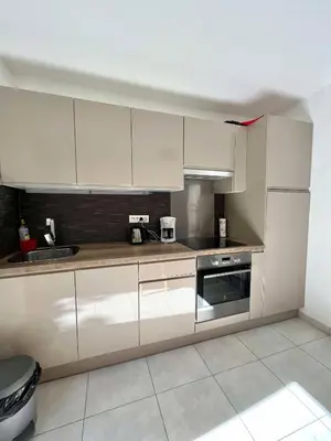 Cuisine ou kitchenette dans l'établissement Bel appartement au calme