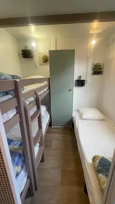 Un ou plusieurs lits dans un hébergement de l'établissement Chalet climatisé en Haute-Corse 500m plage - camping Marina di Sorbo