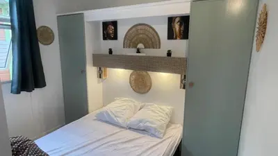 Un ou plusieurs lits dans un hébergement de l'établissement Chalet climatisé en Haute-Corse 500m plage - camping Marina di Sorbo