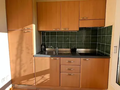 Cuisine ou kitchenette dans l'établissement T3 climatisé pour 4 à 6 personnes proche mer en Corse
