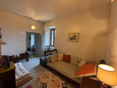 Coin salon dans l'établissement Maison de Caractère au coeur du village