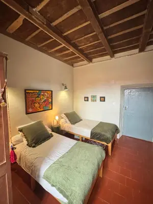 Un ou plusieurs lits dans un hébergement de l'établissement Maison de Caractère au coeur du village