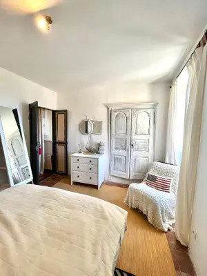Un ou plusieurs lits dans un hébergement de l'établissement Superbe maison de charme vue mer