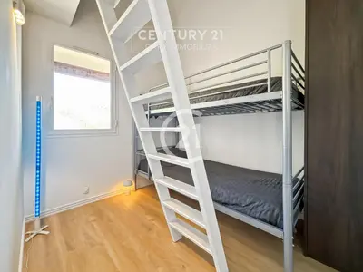 Un ou plusieurs lits dans un hébergement de l'établissement Pointe St-François T3 vue mer