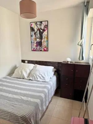 Un ou plusieurs lits dans un hébergement de l'établissement Bel appartement vue mer-montagne