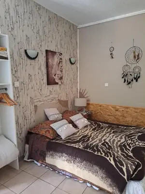 Un ou plusieurs lits dans un hébergement de l'établissement Appartements Luccisano