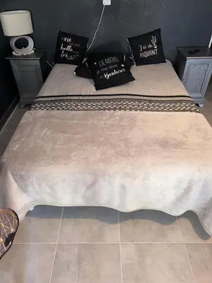 Un ou plusieurs lits dans un hébergement de l'établissement Appartements Luccisano