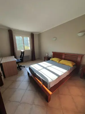 Un ou plusieurs lits dans un hébergement de l'établissement Rez de villa