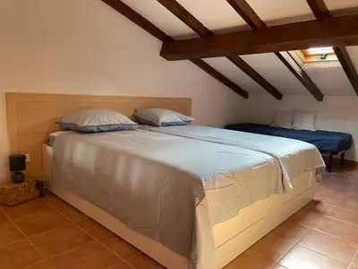 Un ou plusieurs lits dans un hébergement de l'établissement Appartement T2 vue mer, piscine Linguizzetta Bravone
