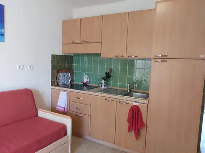 Cuisine ou kitchenette dans l'établissement Appartement avec piscine