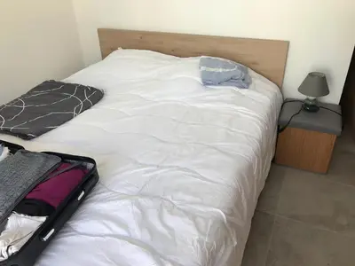 Un ou plusieurs lits dans un hébergement de l'établissement Location Vacances en Coeur de ville - Vue sur Mer - Tout confort