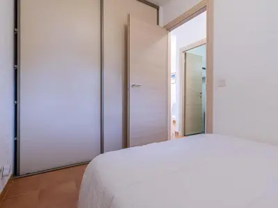 Un ou plusieurs lits dans un hébergement de l'établissement Apartment Casa Antonio by Interhome