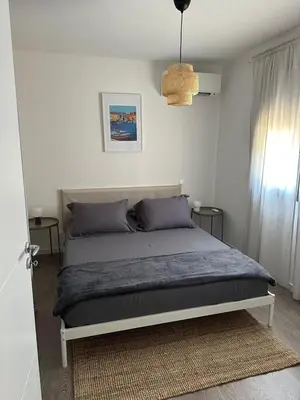 Un ou plusieurs lits dans un hébergement de l'établissement Casa Juliette Maison bois