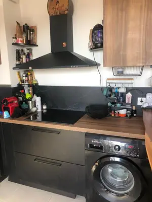 Cuisine ou kitchenette dans l'établissement T3 Baie de Calvi jardin panoramique vue mer