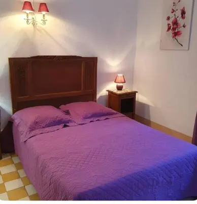 Un ou plusieurs lits dans un hébergement de l'établissement Appartement Caprunale Rivière & Maquis