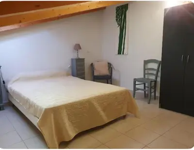 Un ou plusieurs lits dans un hébergement de l'établissement Appartement Paglia Orba Rivière & maquis