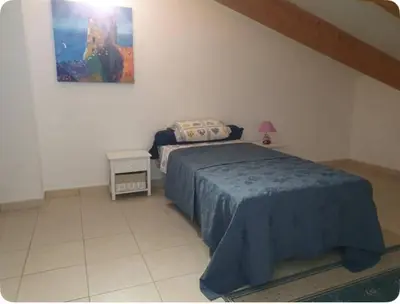 Un ou plusieurs lits dans un hébergement de l'établissement Appartement Paglia Orba Rivière & maquis