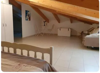 Un ou plusieurs lits dans un hébergement de l'établissement Appartement Paglia Orba Rivière & maquis