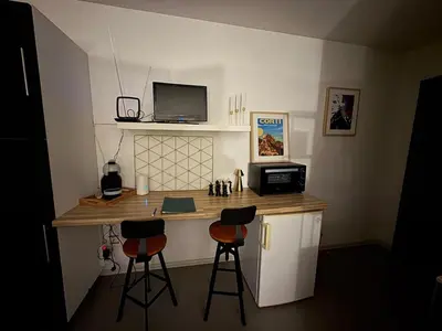 Cuisine ou kitchenette dans l'établissement Studio Gare Corte