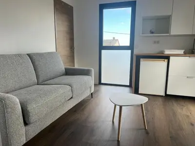 Coin salon dans l'établissement Appartement au bord de mer