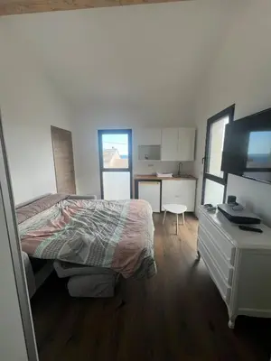 Un ou plusieurs lits dans un hébergement de l'établissement Appartement au bord de mer