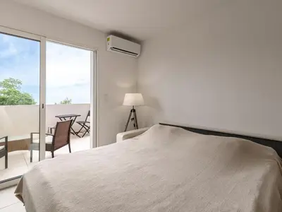 Un ou plusieurs lits dans un hébergement de l'établissement Studio Brigitte by Interhome