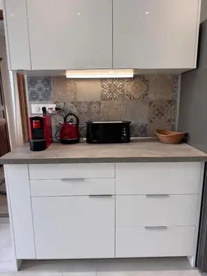 Cuisine ou kitchenette dans l'établissement Appartement au cœur du village