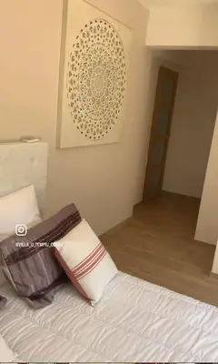 Un ou plusieurs lits dans un hébergement de l'établissement Chambre Lavighiu