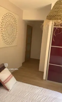 Un ou plusieurs lits dans un hébergement de l'établissement Chambre Lavighiu