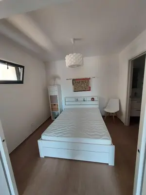 Un ou plusieurs lits dans un hébergement de l'établissement T2 moderne en rez-de-villa