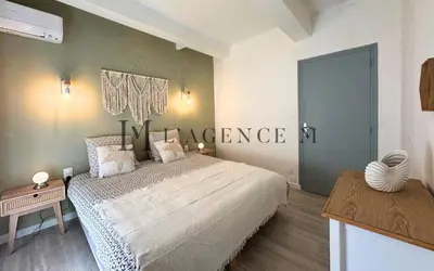 Un ou plusieurs lits dans un hébergement de l'établissement Appartement Mercatu au coeur de Calvi
