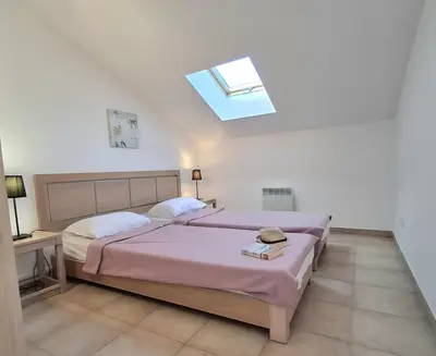 Un ou plusieurs lits dans un hébergement de l'établissement Villas MELODY - Appartement climatisé 4/6 pers