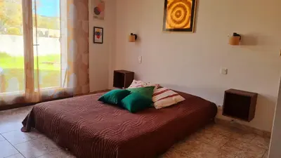 Un ou plusieurs lits dans un hébergement de l'établissement Villa à quelques pas de la plage