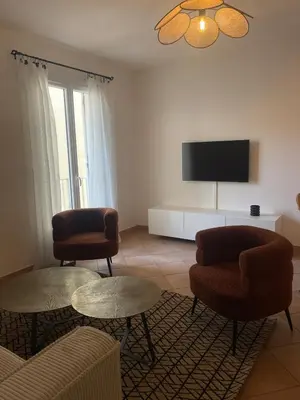 Télévision ou salle de divertissement dans l'établissement Appartement vue Mer en plein centre