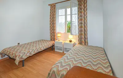 Un ou plusieurs lits dans un hébergement de l'établissement Villa Plage À Pieds
