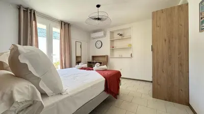 Un ou plusieurs lits dans un hébergement de l'établissement Les Chambres de Giottani