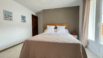 Un ou plusieurs lits dans un hébergement de l'établissement Les Chambres de Giottani